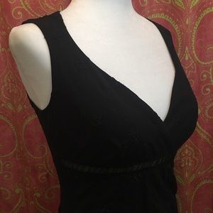 Black knee length super feminine dress.
